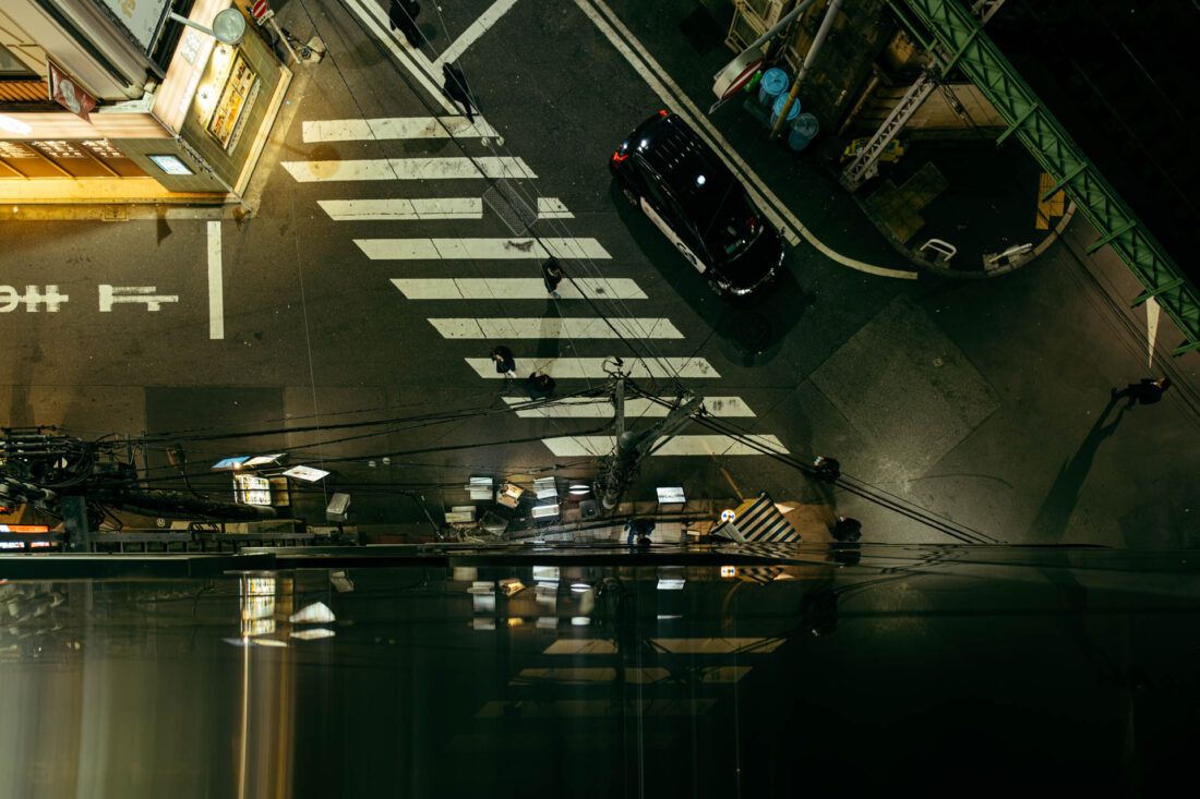 crosswalk reflection by robert mangelmann | 20231129tokyo_304